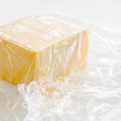 cheese-wrapped-in-cling-film-or-plastic-wrap-2023-11-27-05-14-56-utc